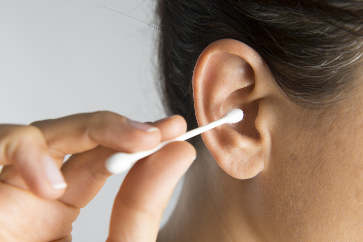 woman-cleaning-ear-with-cotton-swab