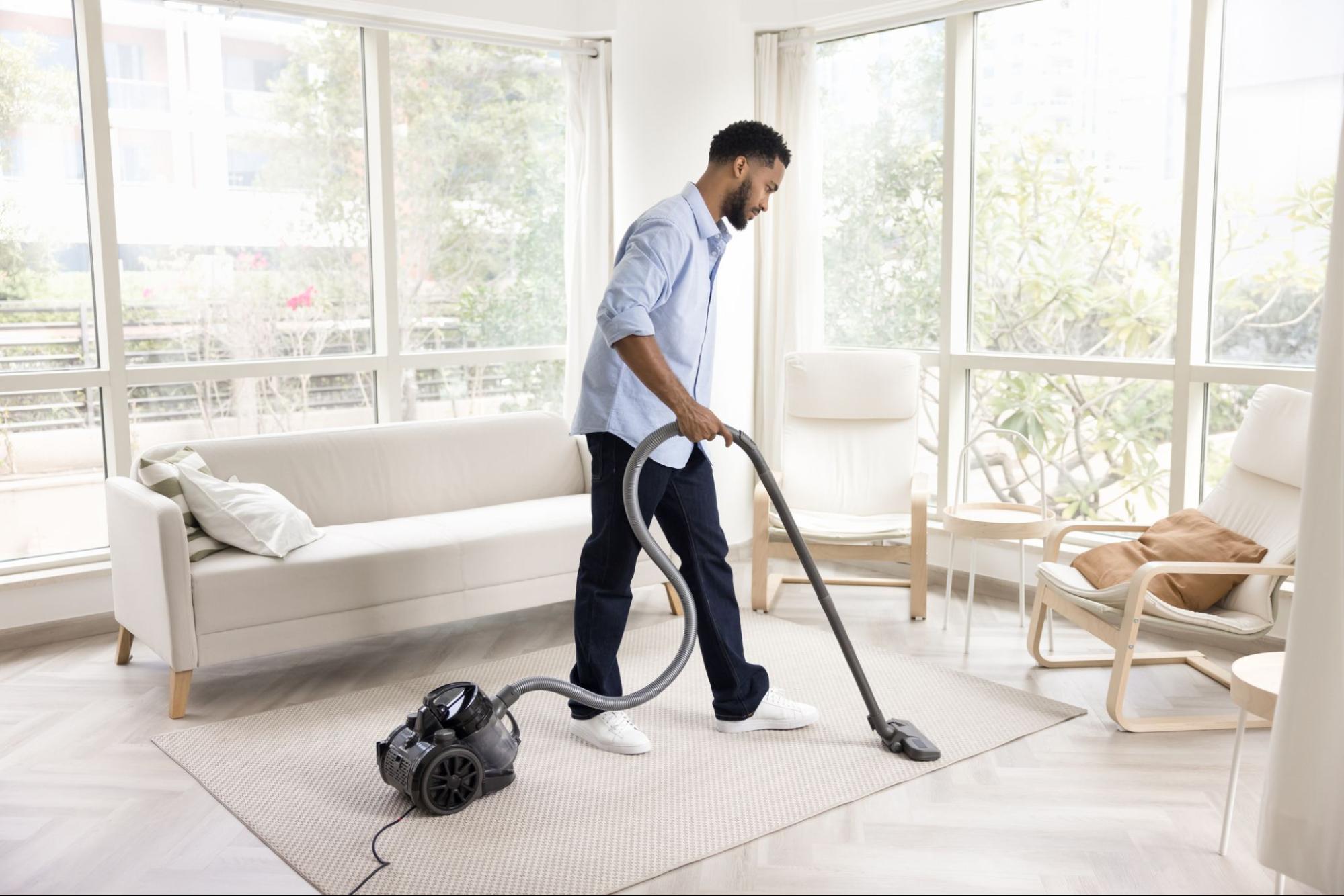 Man-vacuuming-to-allergy-proof-home